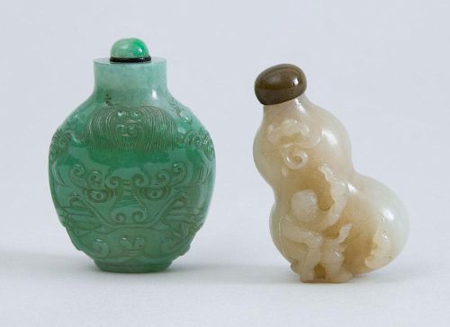 TWO CHINESE CARVED JADE SNUFF BOTTLES AND STOPPERS