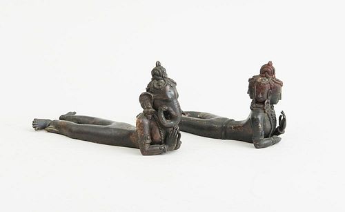 PAIR OF INDIAN BRONZE RECLINING FIGURES, REPRESENTING GANESH AND BRAHMA