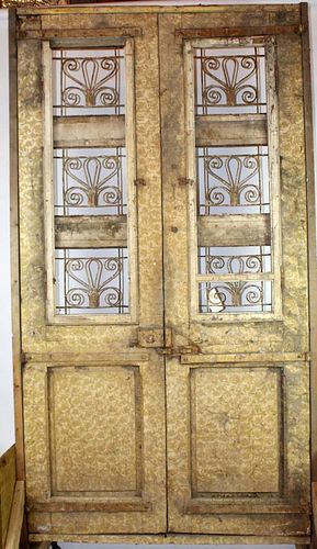 Pair weathered & carved entry doors with iron panels