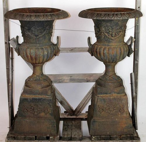Pair of cast iron double handled garden urns
