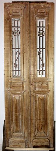 Pair of carved and weathered wood entry doors