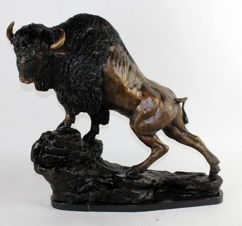 Bronze bison statue on marble base