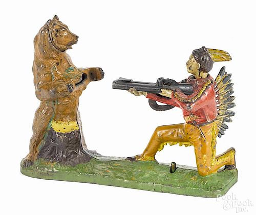 Cast iron Indian Shooting Bear mechanical bank, manufactured by J. & E. Stevens Co.