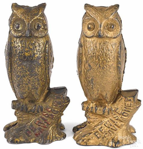 Two cast iron Be Wise Save Money owl still banks, 5'' h.