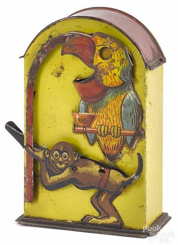Tin lithograph parrot and monkey mechanical bank, 6'' h.