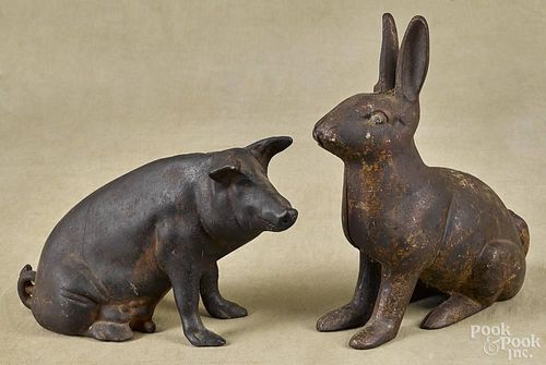 Two contemporary cast iron still banks, to include a pig and a rabbit, tallest - 11''.