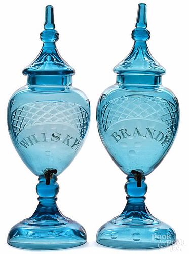 Pair of cut glass liquor dispensers, 20th c., one engraved Brandy, the other Whisky, sic, 31'' h.