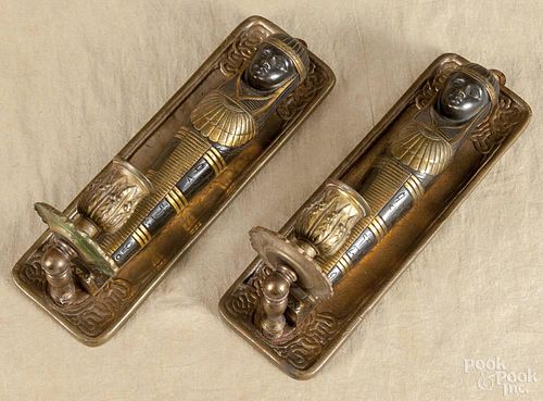 Two Tiffany Studio pen trays converted to candle sconces with Egyptian sarcophaguses, 10'' h.