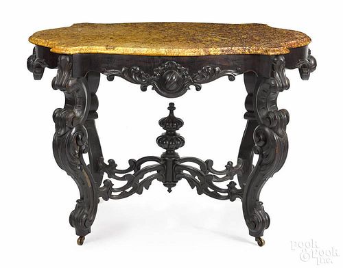 Victorian marble top console table, late 19th c., with a shaped turtle top, 30 1/2'' h., 42 1/2'' w.