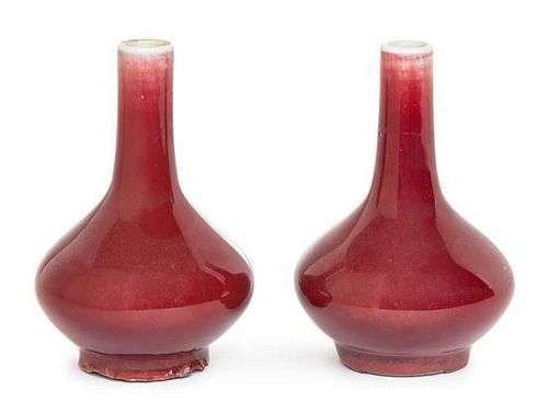 * A Small Pair of Sang-de-Boeuf Glazed Porcelain Vases Height 4 1/2 inches.