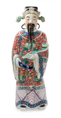 A Famille Rose Porcelain Figure of an Immortal Height 25 inches.