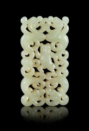 A Carved Celadon Jade Pendant Length 2 3/4 x width 1 3/8 inches.