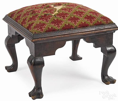 Pennsylvania Queen Anne walnut footstool, late 19th c., with cabriole legs and trifid feet, 18'' h.