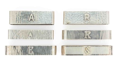 THE KALO SHOP AND LEBOLT & CO., CHICAGO, ILLINOIS ARTS AND CRAFTS STERLING SILVER NAPKIN RINGS, LOT OF SIX