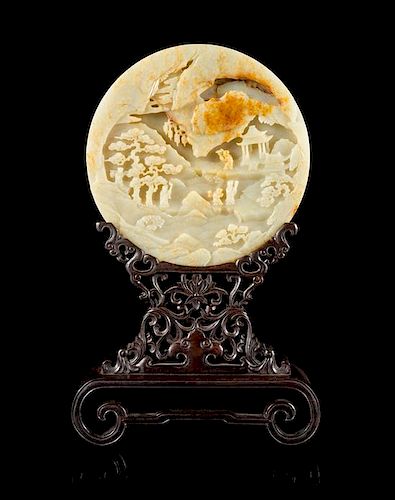 A Carved Celadon Jade Table Screen Diameter of jade 8 1/4 inches.