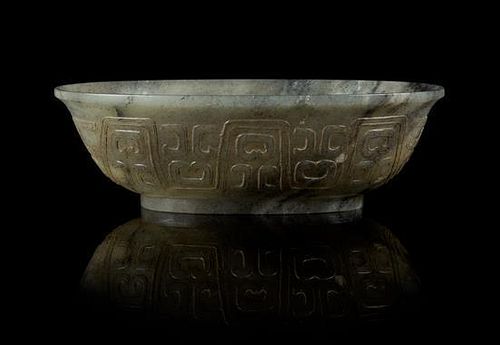 A Black and White Jade Bowl Length 6 1/2 inches.