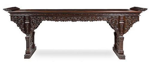 A Massive Chinese Hardwood Altar Table, Qiaotou'an Height 45 1/2 x width 126 1/4 x depth 20 1/4 inches.