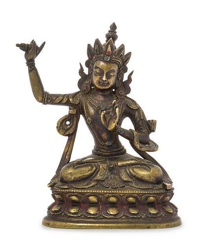 * A Sino-Tibetan Gilt Bronze Figure of Manjushri Height 4 1/8 inches.