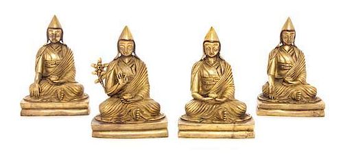A Set of Four Sino-Tibetan Gilt Bronze Figures of Gelugpa Lamas Height of each 4 5/8 inches.