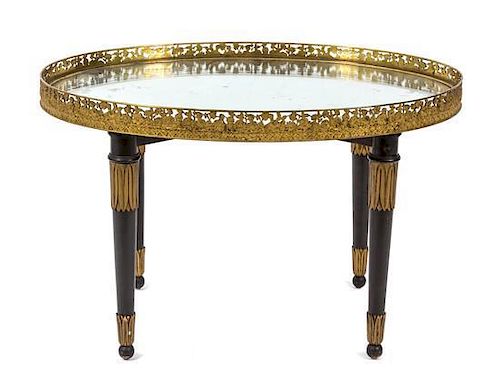 A Neoclassical Style Ebonized Oval Tray Top Table Height 19 1/2 x width 30 1/2 x depth 21 3/4 inches.