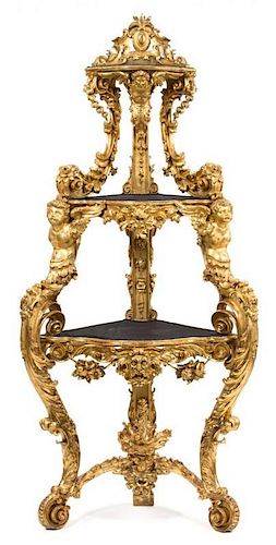 An Italian Rococo Carved Giltwood Corner Etagere Height 86 x width 37 x depth 22 inches.