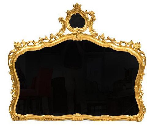 An Italian Rococo Style Giltwood Wall Mirror Height 45 x width 51 inches.