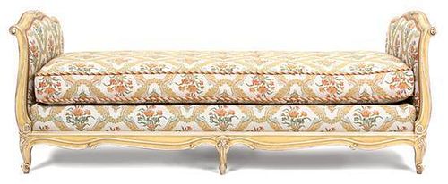 A Louis XV Style Painted and Upholstered Carved Wood Day Bed Height 31 x width 83 x depth 35 1/2 inches.
