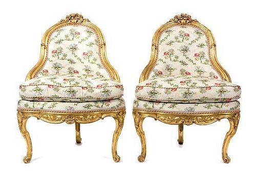A Pair of Louis XV Style Giltwood Corner Chairs Height 37 1/2 x width 26 x depth 24 inches.