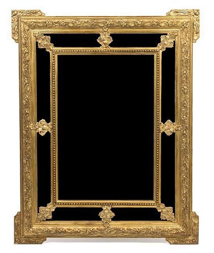 A Louis XVI Style Giltwood Double Framed Mirror 40 x 50 3/4 inches.