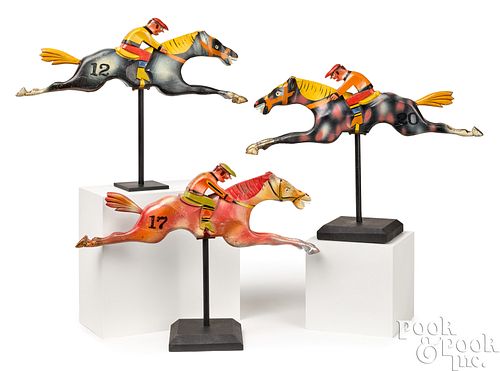 Three carnival horse and jockey figures