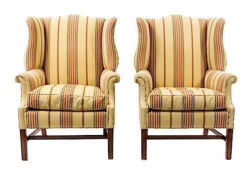 A Pair of George I Style Mahogany Wing Chairs Height 40 1/2 x width 26 1/2 x depth 33 inches.