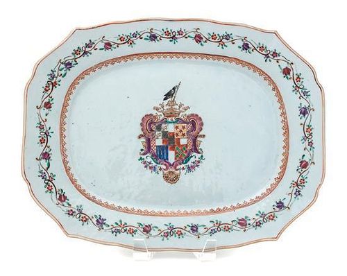 An English Lowestoft Armorial Platter Length 13 1/4 inches.
