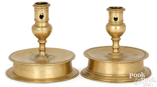Two similar brass capstan candlesticks
