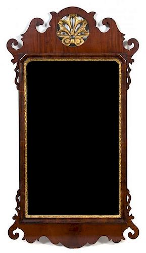 A George II Style Mahogany and Giltwood Mirror 52 1/4 x 27 1/2 inches.