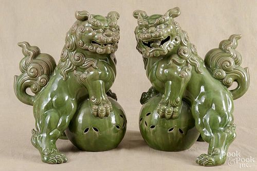 Pair of contemporary Chinese foo lion statues, 20th c., 16 1/2'' h.