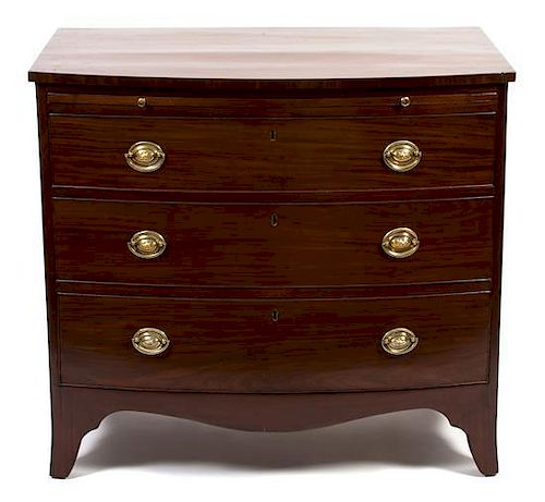 A George III Mahogany Bow Front Bachelor's Chest Height 33 1/4 x 37 x 22 1/2 inches.