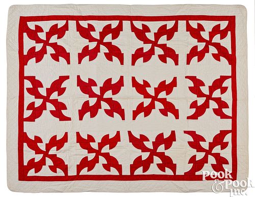 Red and white Drunkard's Path patchwork quilt