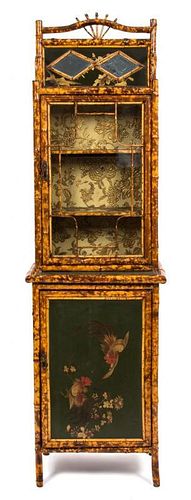 A Victorian Lacquered and Gilt Bamboo Display Cabinet Height 77 x width 22 1/4 x depth 16 1/2 inches.