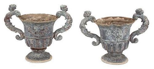 A Pair of Neoclassical Style Composition Campana Form Garden Urns Height 19 1/4 inches.