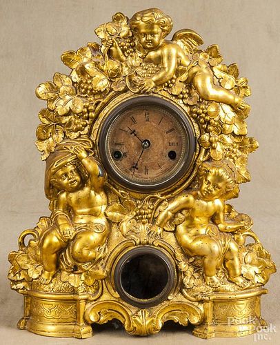 Gilt iron mantel clock, 19th c., with cherubs, 16'' h.