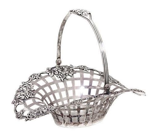 A Birks Sterling Silver Reticulated Basket, 20th century, having a grapevine border and swing handle.