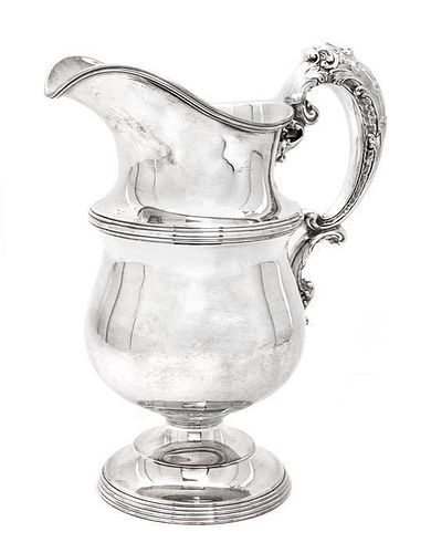An American Silver Pitcher, Meriden Brittania Co., Meriden, CT, having an acanthus decorated C-scroll handle, reeded borders.