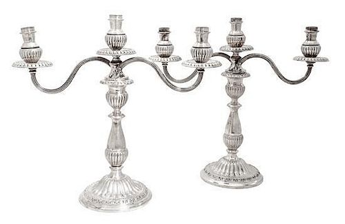 A Pair of Mexican Silver Three-Light Convertible Candelabra, Industria Peruana, having baluster-form stems with reeded arms