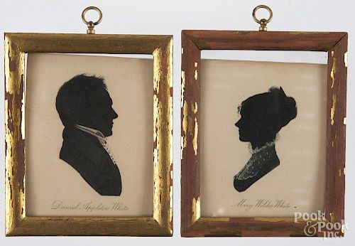 Pair of printed silhouettes of Daniel and Mary White, together with a pair of miniature theorem