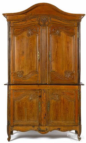 French three-part pine wardrobe, 19th c., with carved doors, 93'' h., 51'' w.