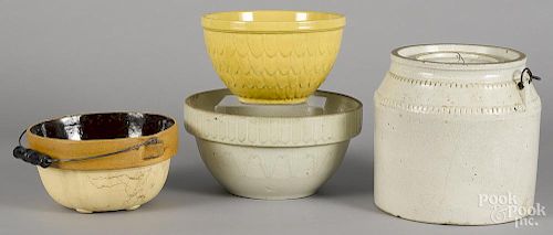 Four pieces of stoneware and pottery, to include a McCoy yellow glaze bowl, tallest - 8 1/2''.