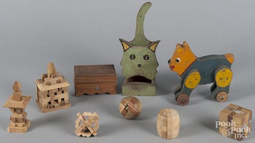 Woodenware, to include puzzle balls and cubes, a Swiss music box, etc.