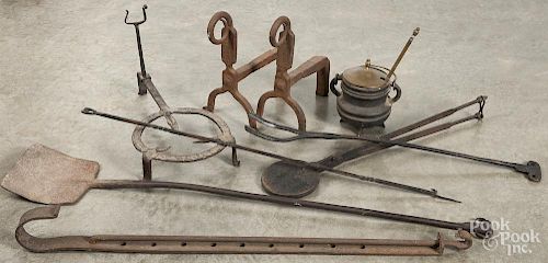 Iron hearth equipment, to include a ram's horn peel, a trivet, andirons, a poker, etc.