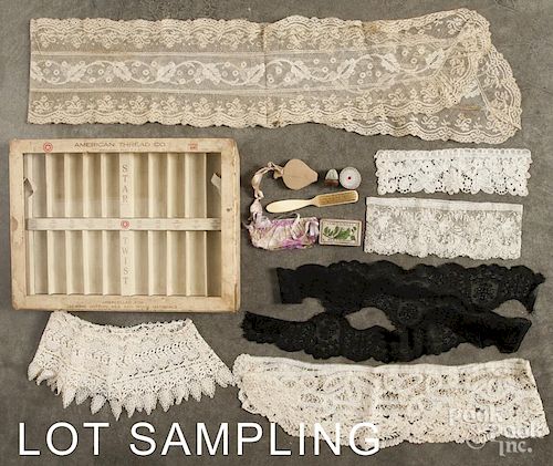 Miscellaneous lace, sewing accessories, and a thread display case.