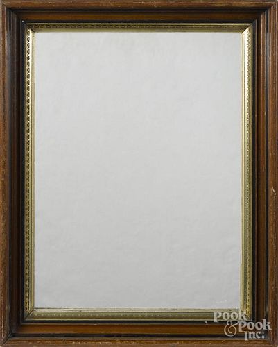 Three walnut frames with gilt liners, two with mirror inserts, together with an Empire mirror